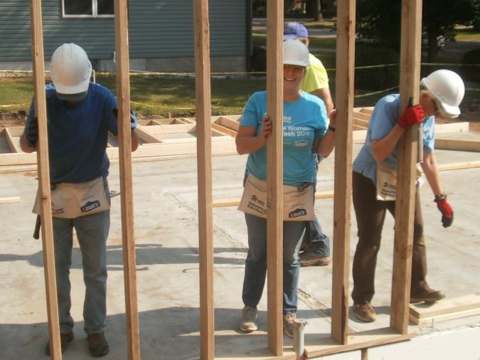 Butenas raising a wall. 