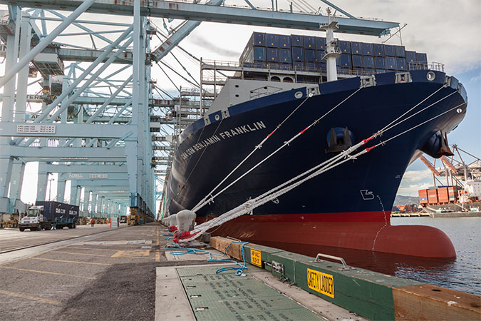 Unloading of docked container ship at Port of Los Angeles Unloading of docked container ship at Port of Los Angeles